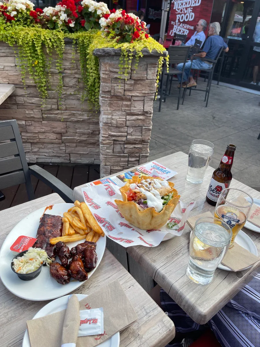 Signature Wing Nachos St Louis Back Ribs Half with Wings Served with Honey Garlic Sauce