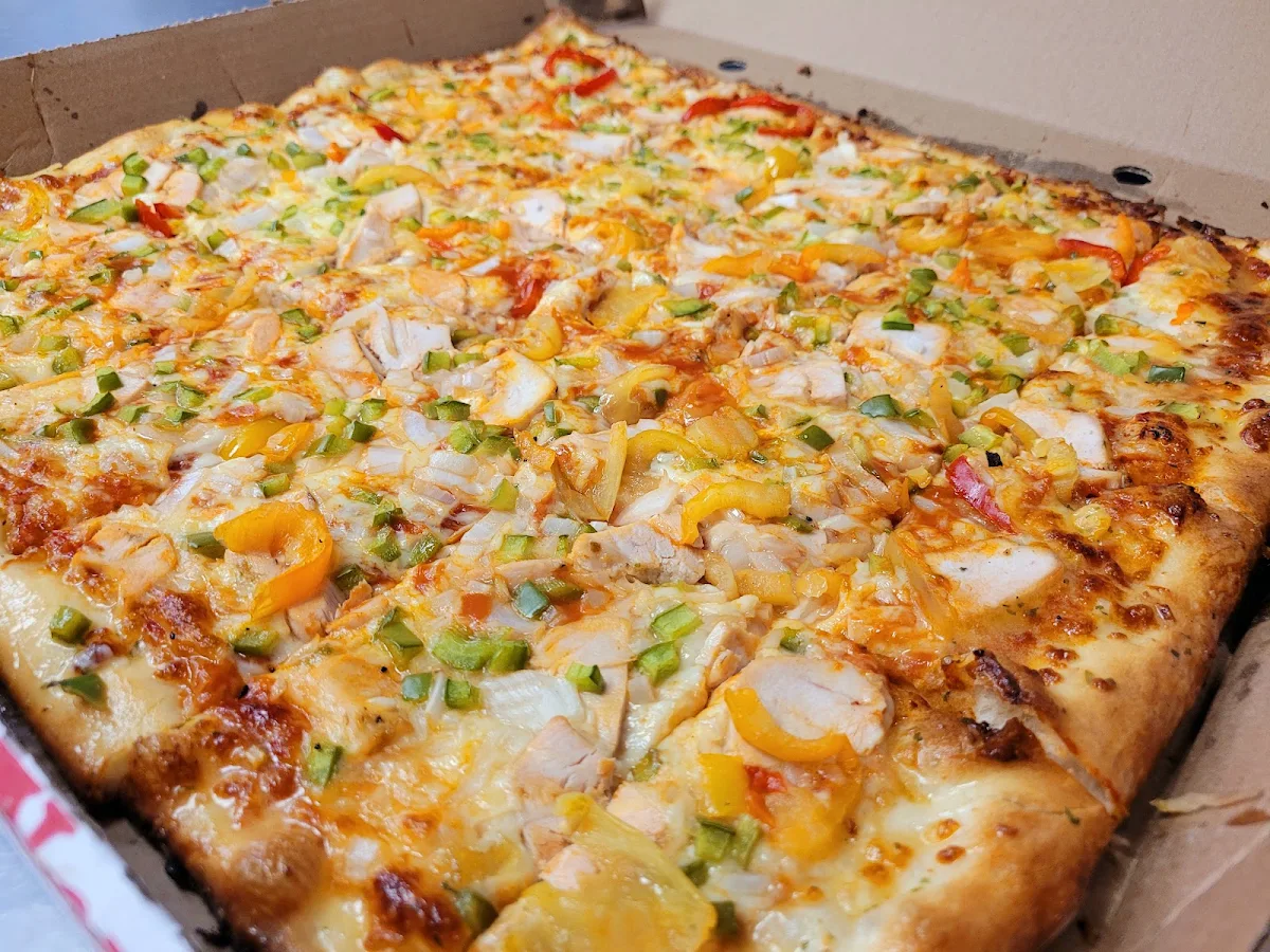 Chicken Green Peppers Onions and Hot Peppers Pizza