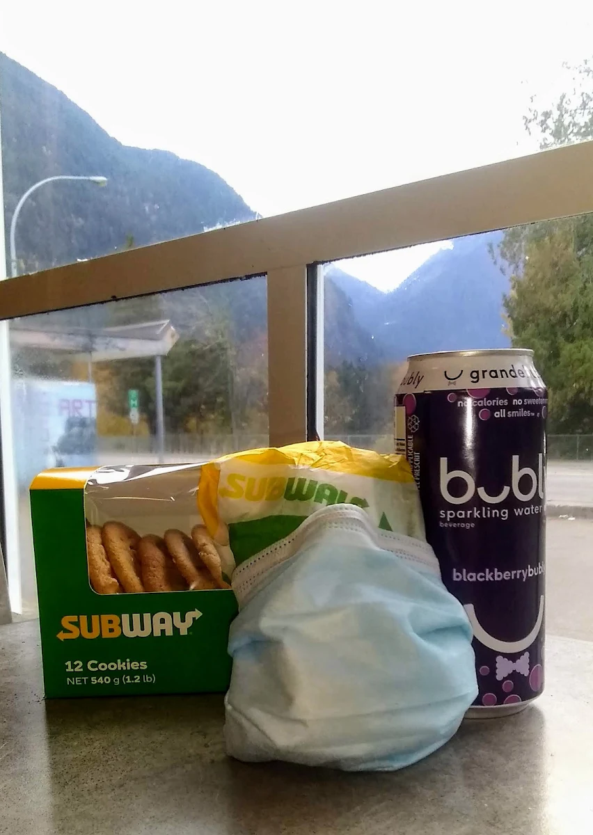 A Custom Pizza Sub a Box of Macadamia Nut Cookies and an over Priced Flavourless Beverage