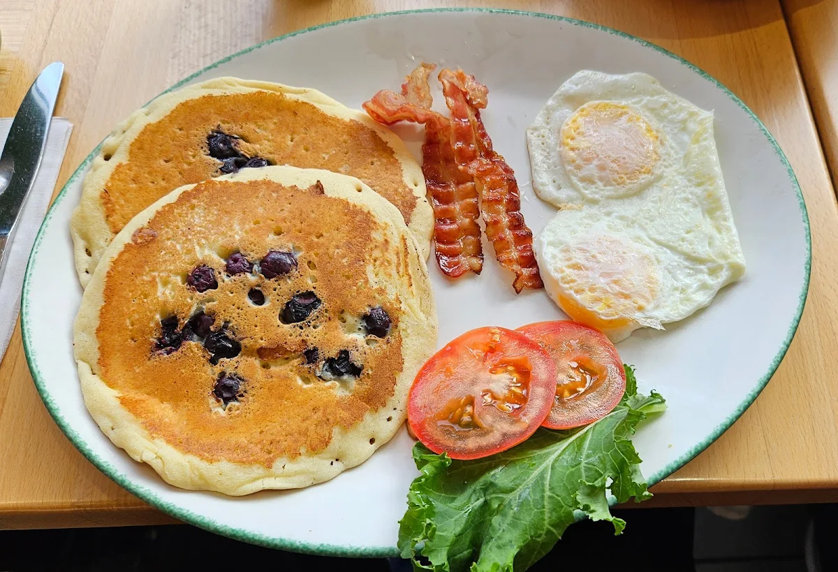 2 Eggs 2 Strips of Beacons 2 Blueberry Pancakes Early Bird Breakfast