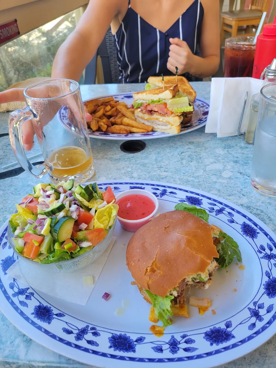 The Classic Burger and Salad and the Clubhouse Sandwich