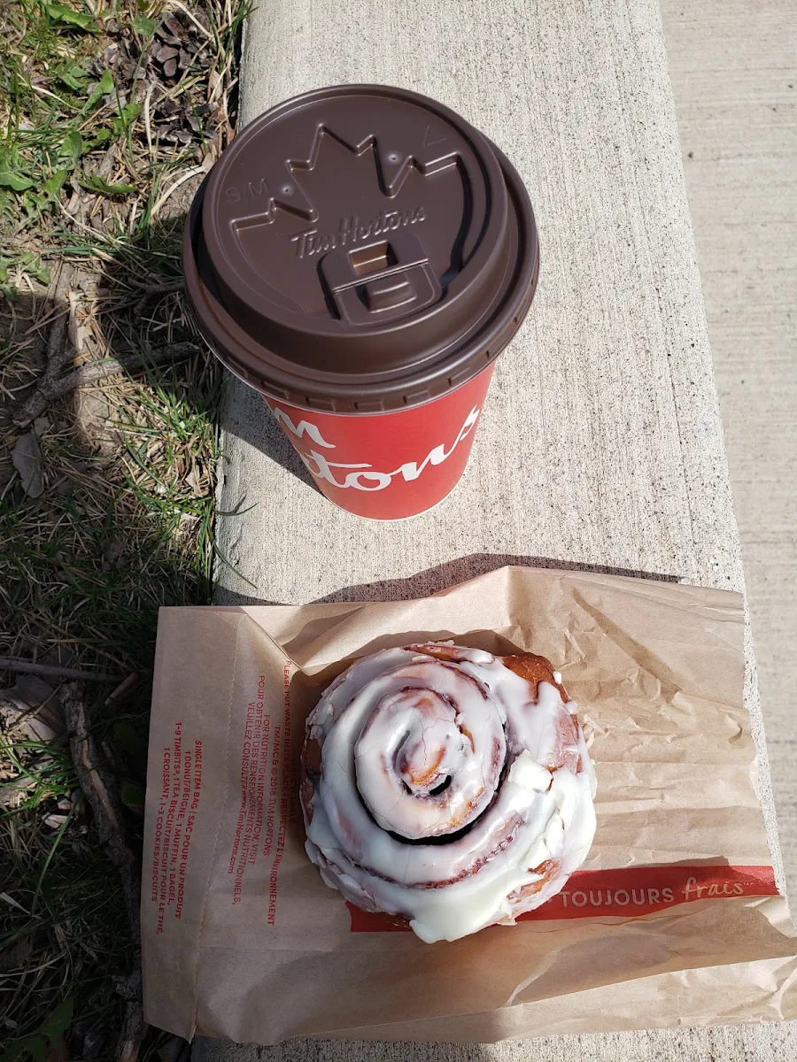 Steeped Tea with Milk and a Cinnamon Roll