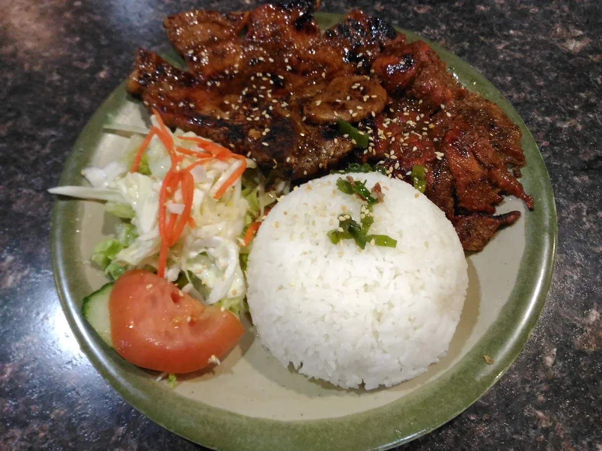 Pork Chop with Two Spring Rolls on Rice