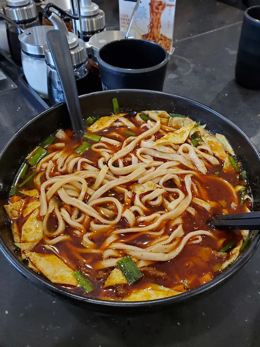 Rolling Noodles in Special Spicy Sour Soup