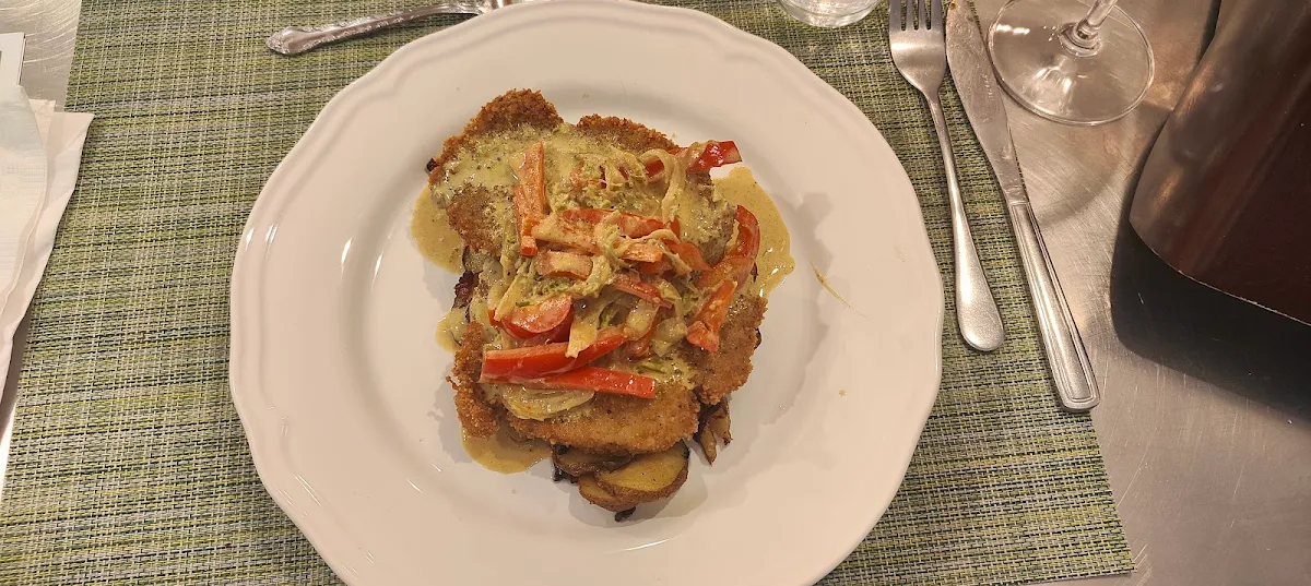 Schnitzel with Onion and Pepper Cream Sauce with Potatoes Onion and Bacon
