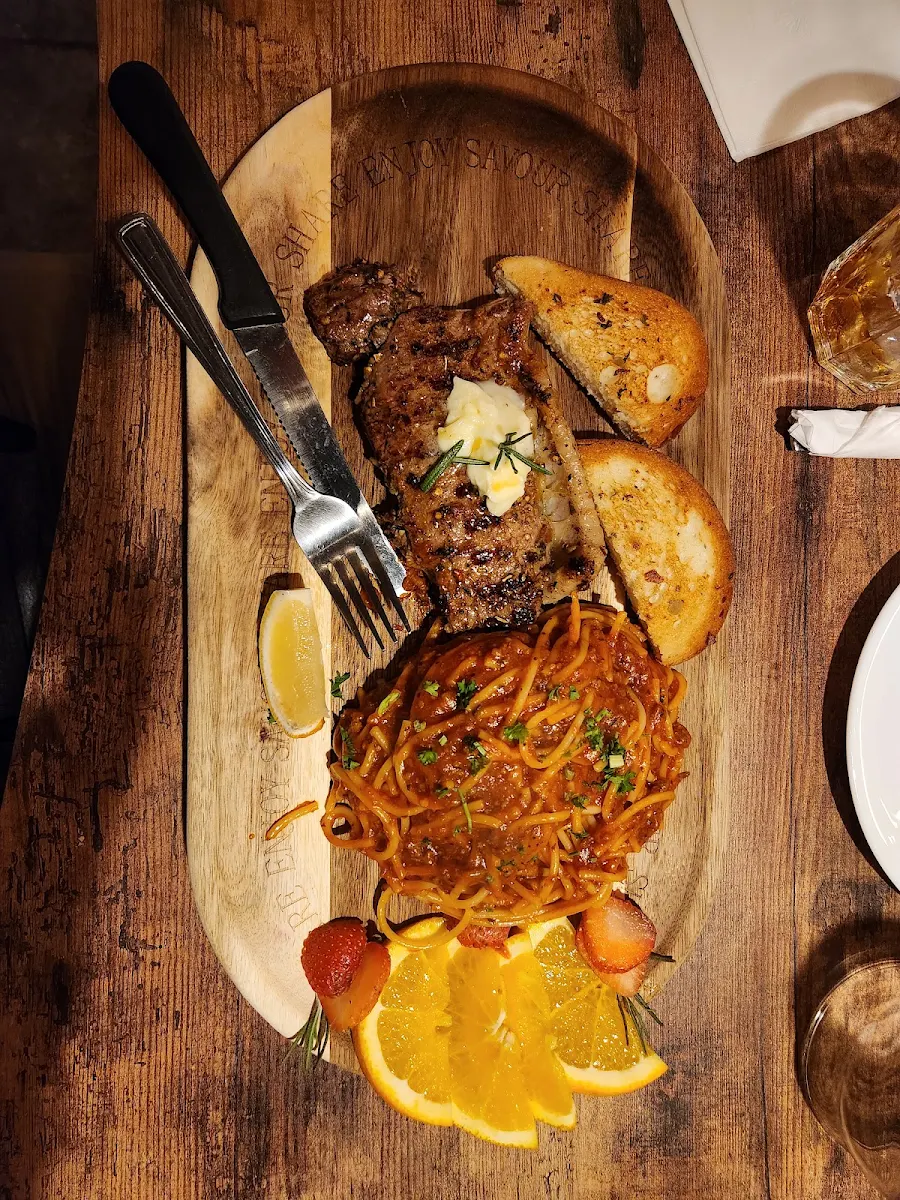 8oz NY Strip Steak and Spaghetti with Meat Sauce