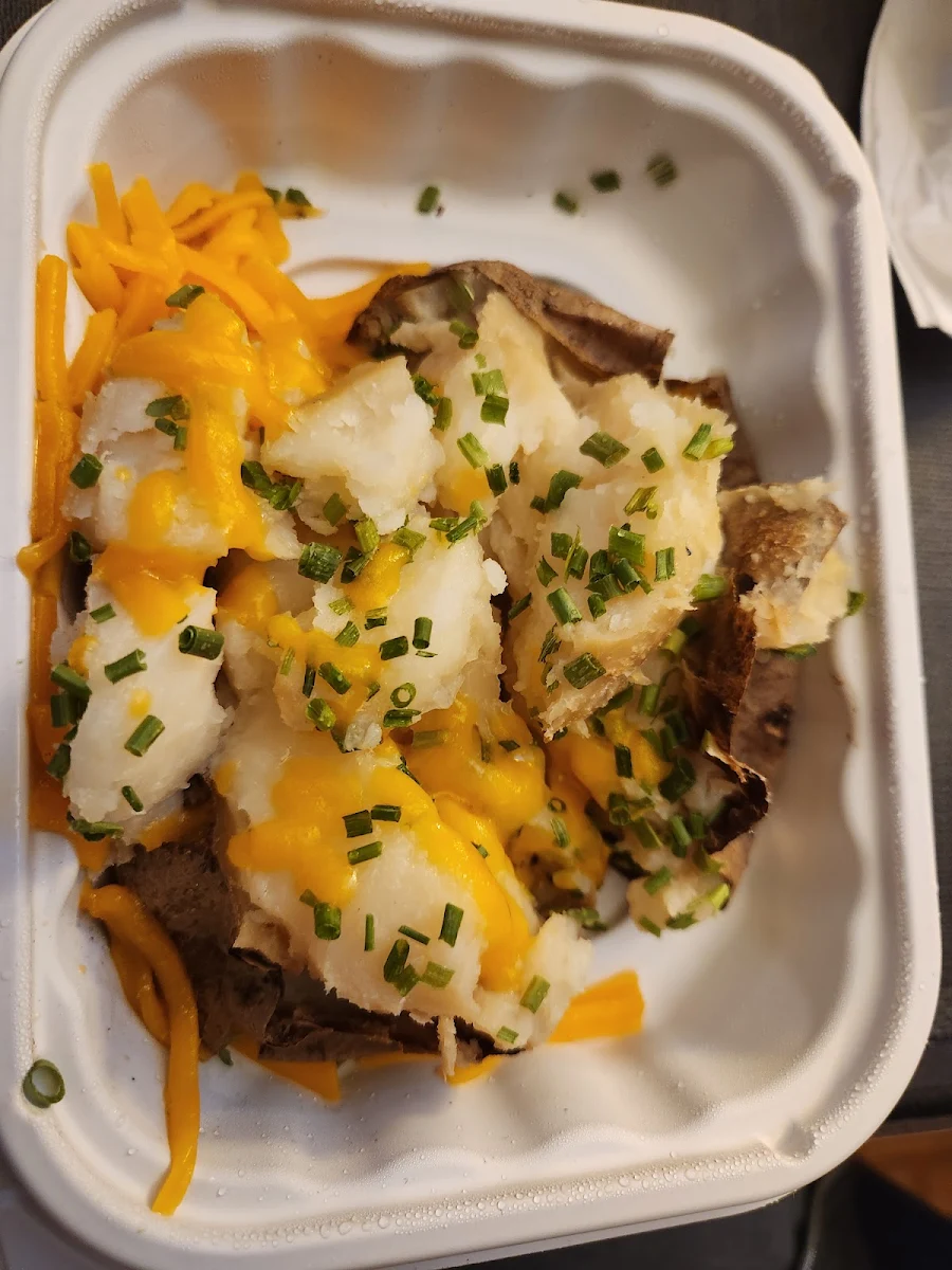 Sour Cream and Chive Baked Potato with Shredded Cheese
