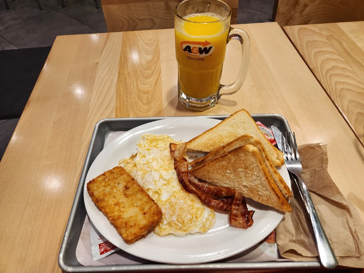Eggs and Bacon with Toast I Added a Hash Brown and a Third Egg Medium Orange Juice