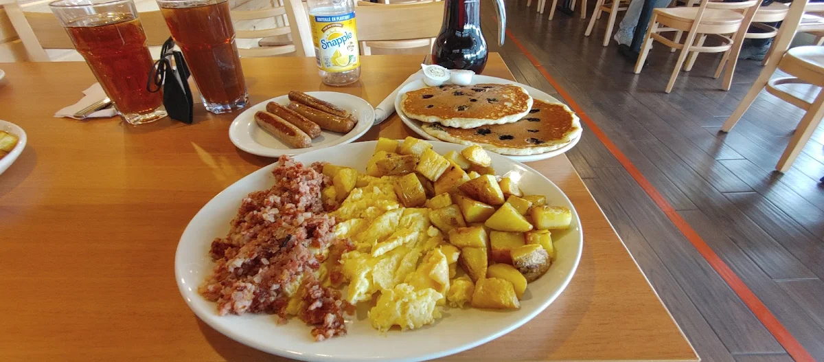 3 Eggs with Corn Beef Hash Blueberry Pancakes and Extra Sausages