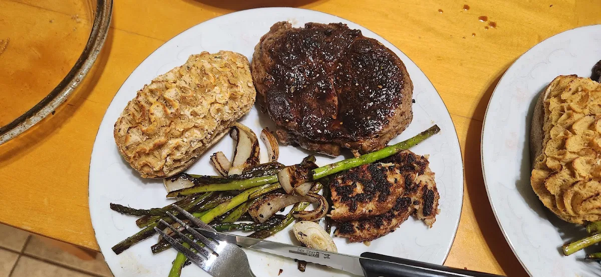 Chef Cut Ribeye Off the Blackstone Crab Cake and Bacon Cheddar Potato