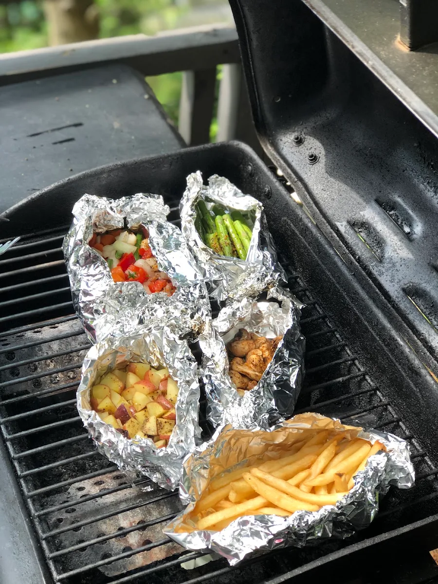 Sparagi and French Fries Mushrooms Small Potato Wedges Tomatoes with Veggies Mix Oil Olives