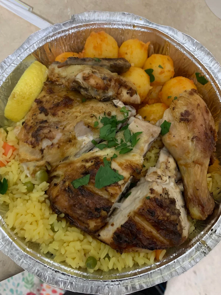Half Roasted Chicken Dinner with Rice and Potatoes