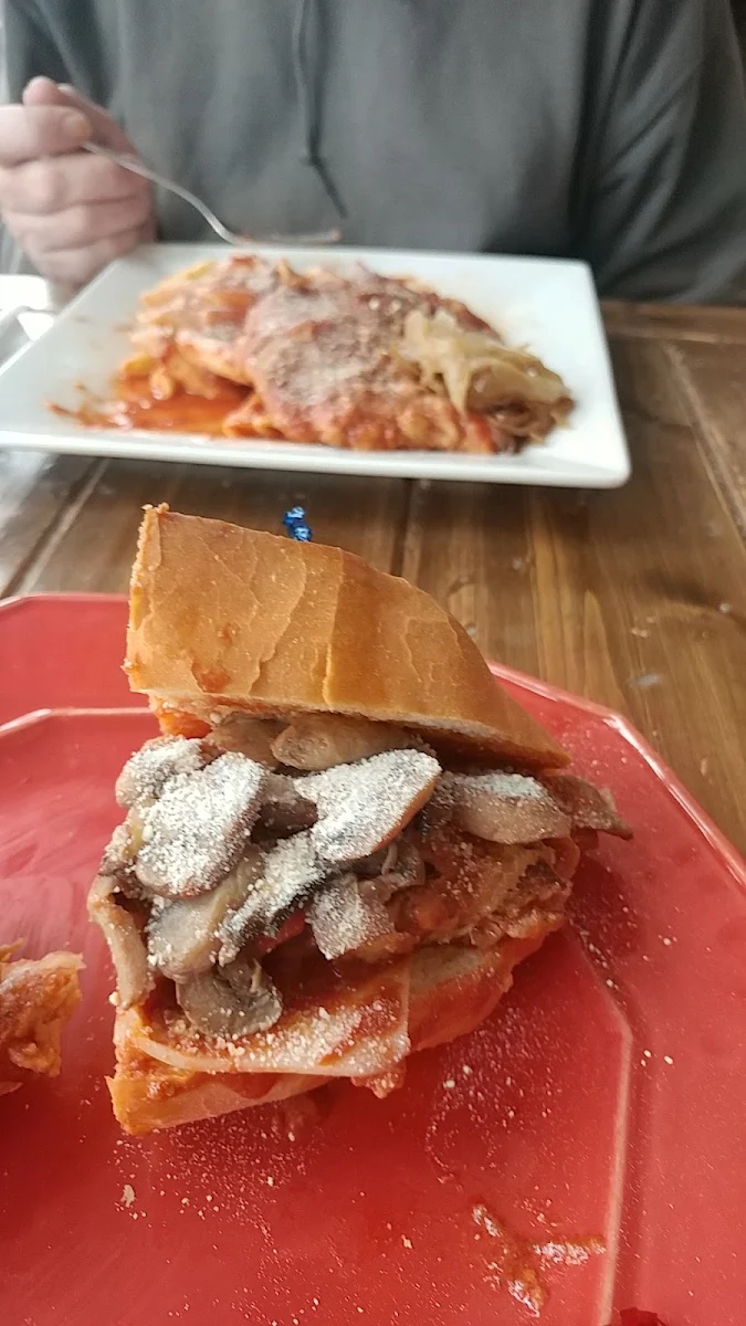 Veal on a Bun with Sauce and Parmesan Cheese