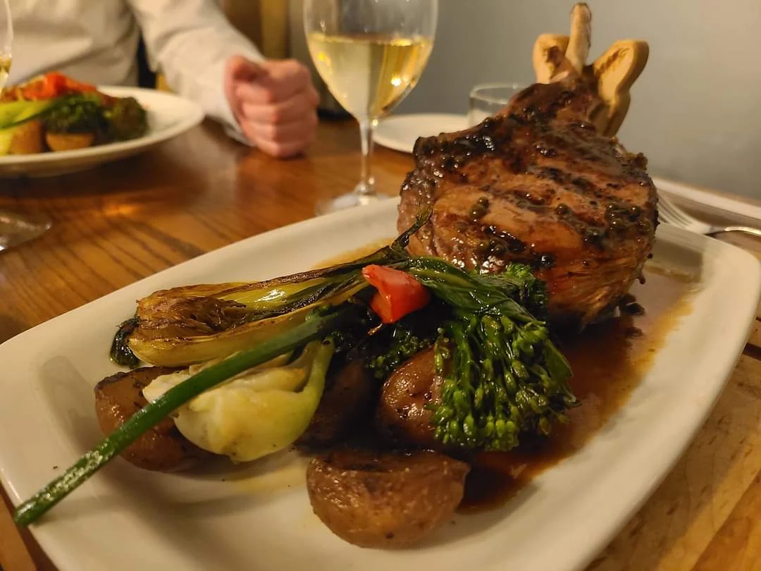 Grilled 16oz Veal Chop Topped with Cognac Green Peppercorn Sauce