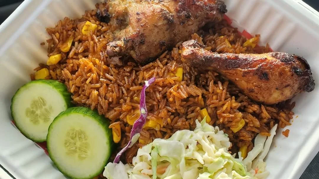 Jollof Rice and Chicken Rice Dish Cooked in A