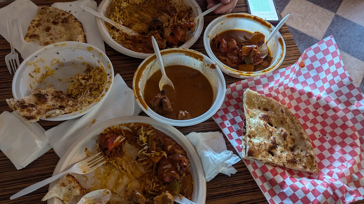 Chicken Tikka Masala Butter Chicken Curry Garlic Naan with a Side of Pulao Rice