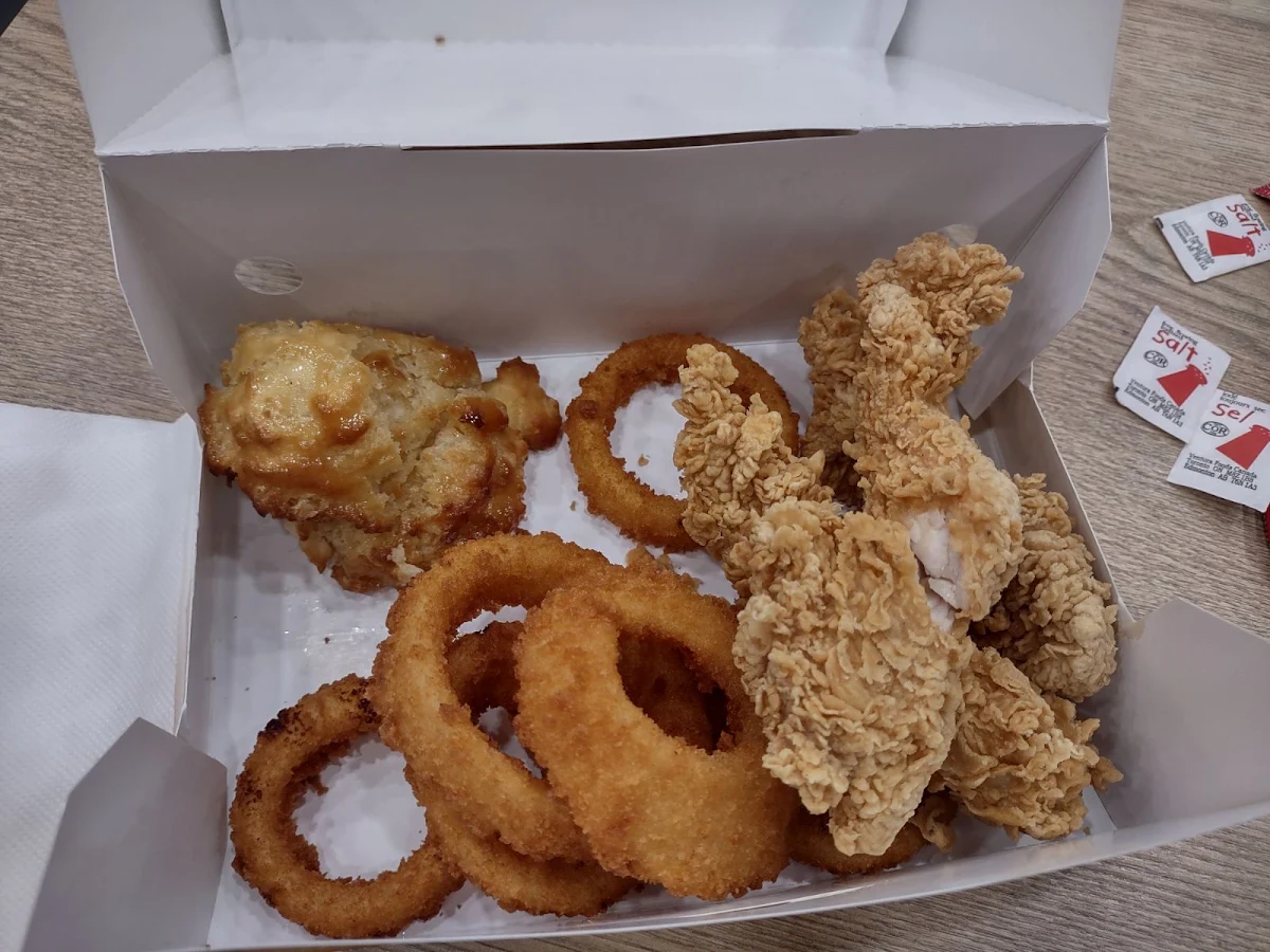Chicken Tenders with Side of Onion Rings and a Biscuit