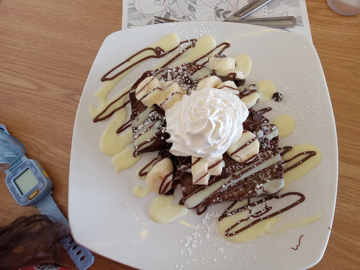 Strawberry Banana Crepe with Cream and Chocolate Toppings