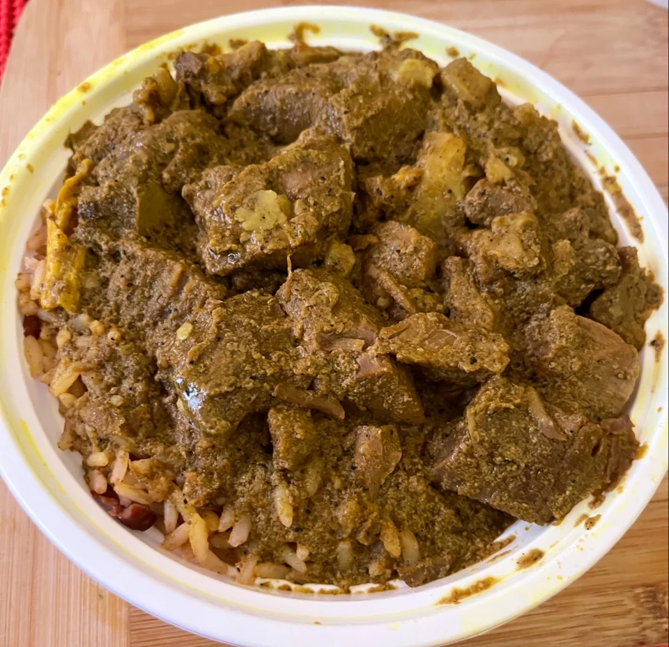 Small Goat Curry on Rice and Peas