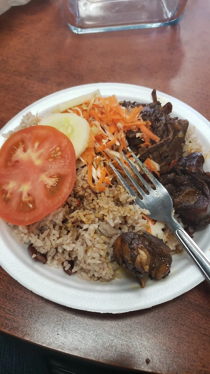 Brown Stew Chicken with Rice and Peas