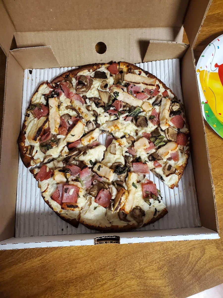 Cauliflower Crust Pizza with Chicken Basil Mushrooms and Bacon
