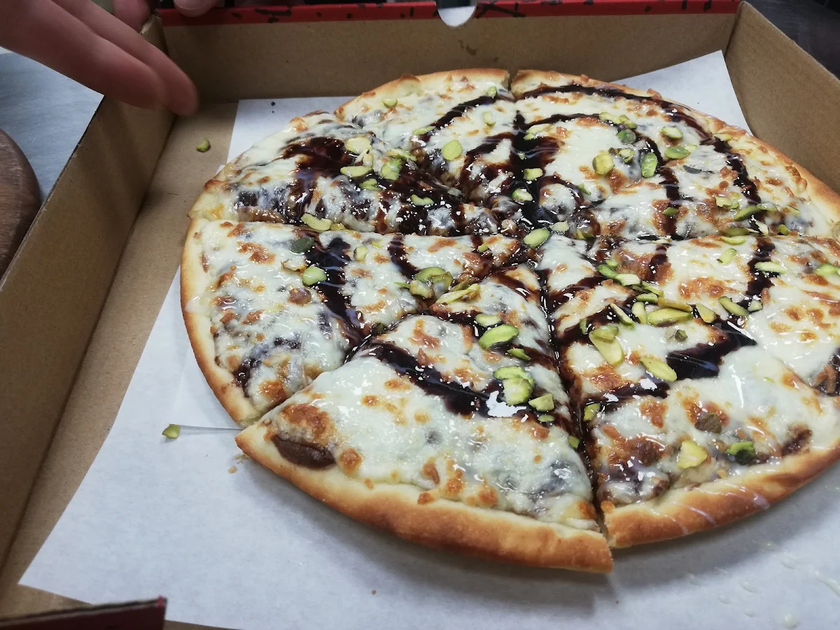 Pizza with Nutella Chocolate Condensed Milk Pistachios and Mozzarella Cheese