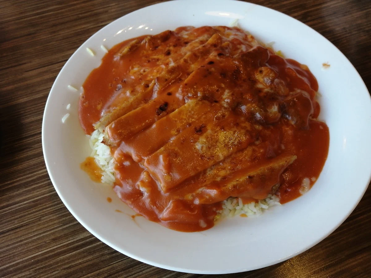 Baked Pork Chop on Rice with Tomato Sauce and Cheese