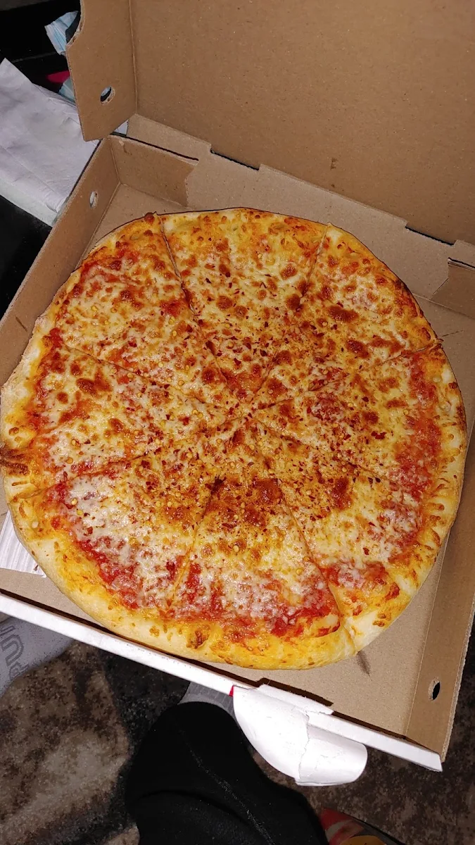 Cheese Pizza Extra Sauce on the Bottom Extra Mozzarella Cheese with Chilli Flakes