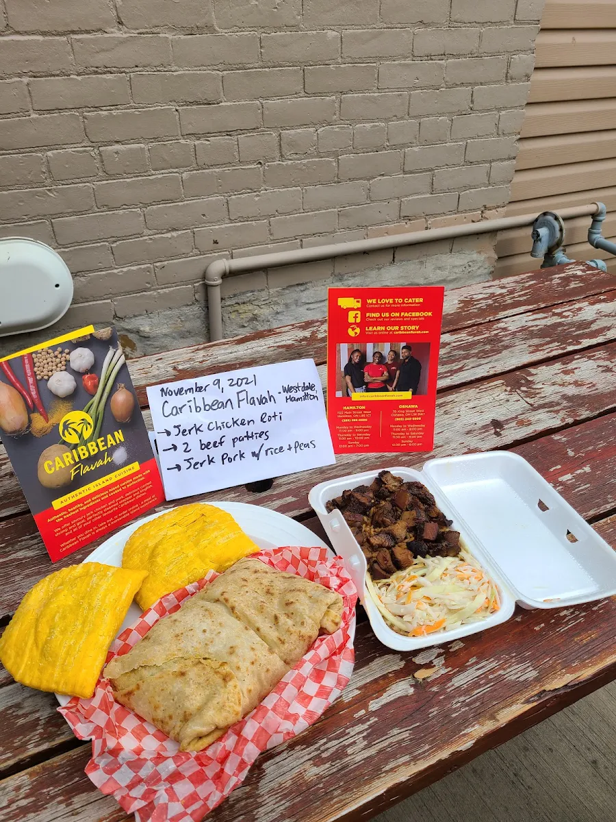 Jerk Chicken Roti Beef Patties Jerk Pork with Rice and Peas