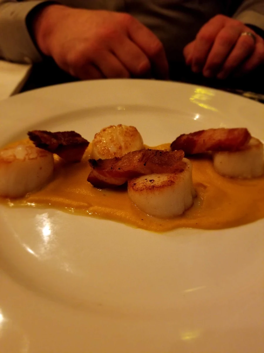 Seared Hokkaido Scallops Smoked Carrot Puree Spicy Italian Sausage Crispy Potato