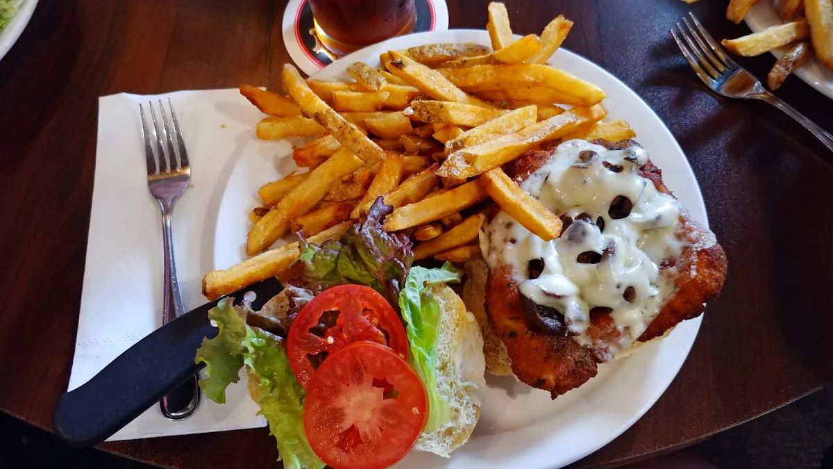 Schnitzel on a Bun with Swiss and Mushrooms