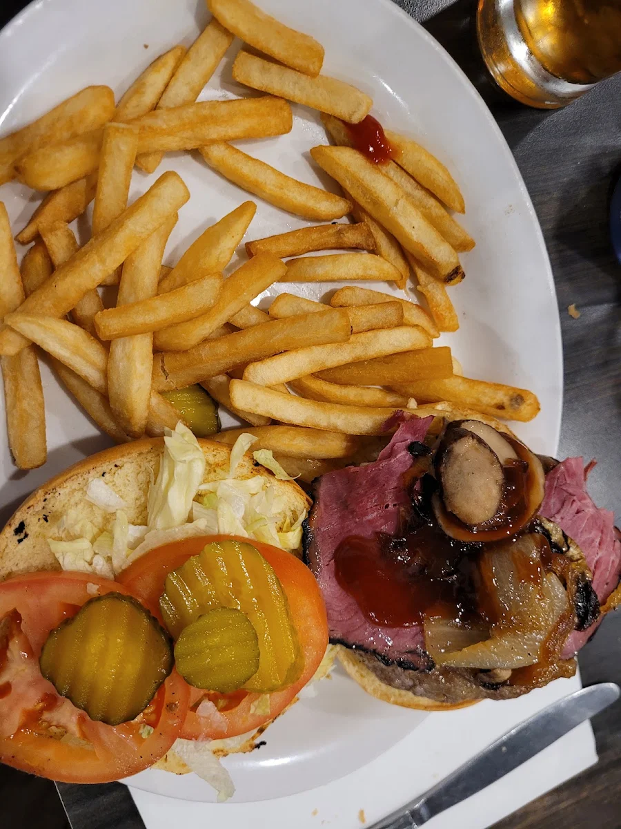The BBQ Burger Half lb Includes Pastrami Sautéed Onions & Mushrooms and BBQ Sauce