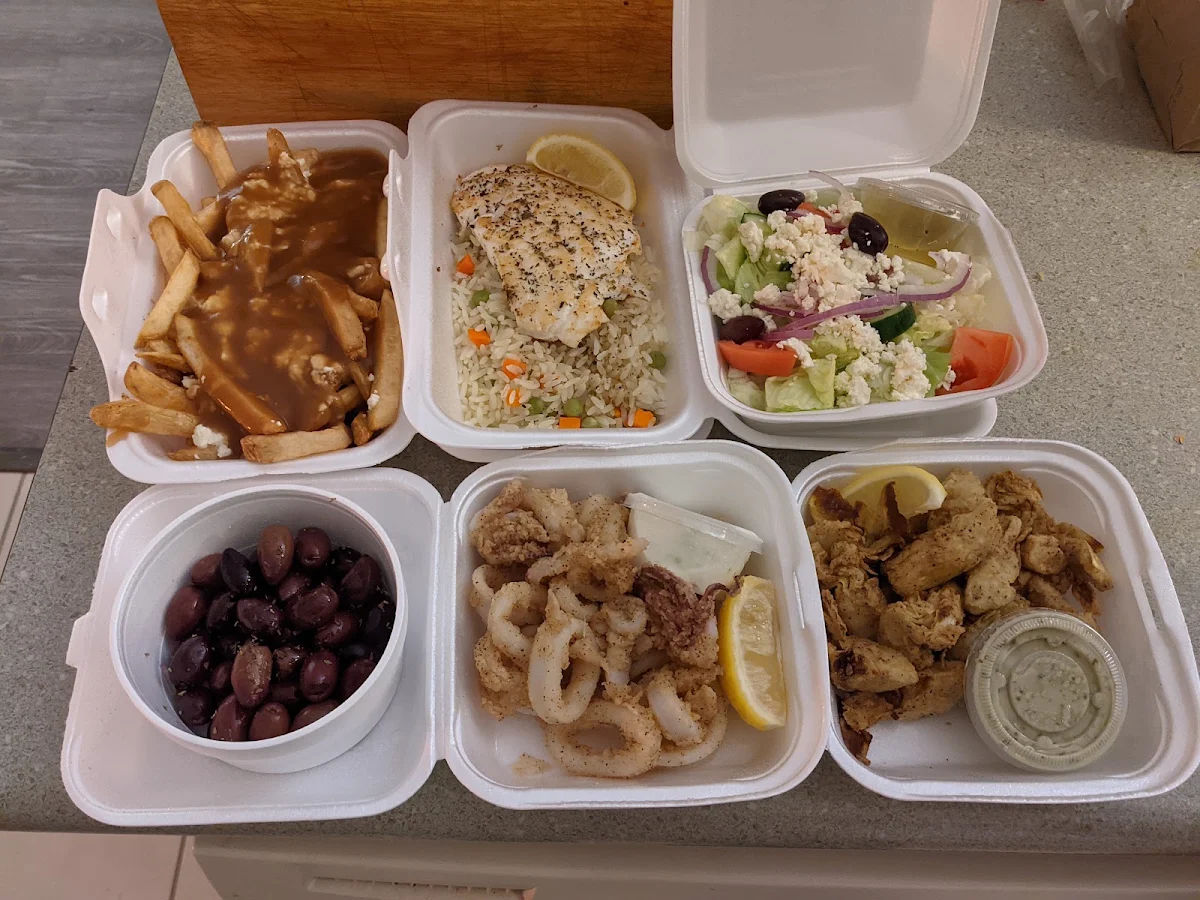 Poutine Grilled Halibut on Rice Greek Salad Olives Calamari Artichoke Hearts