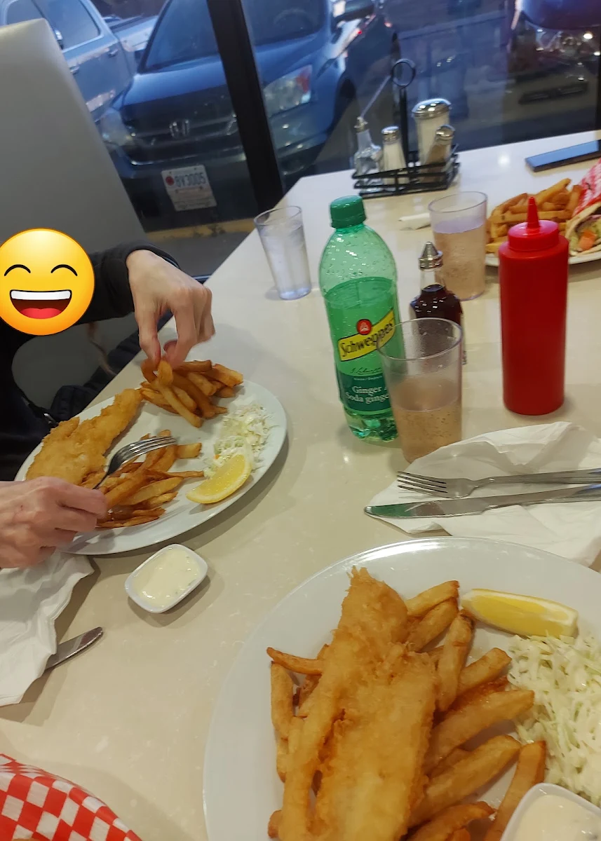 A Cod Dinner Fish and Chips with Coleslaw and Tartar Sauce