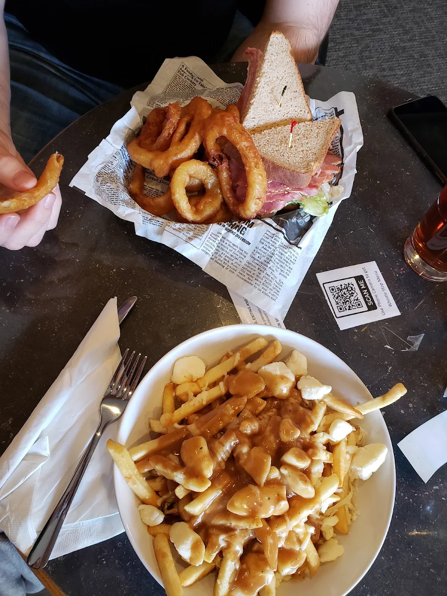 Stacked Ham Sandwich with Onion Rings and Poutine