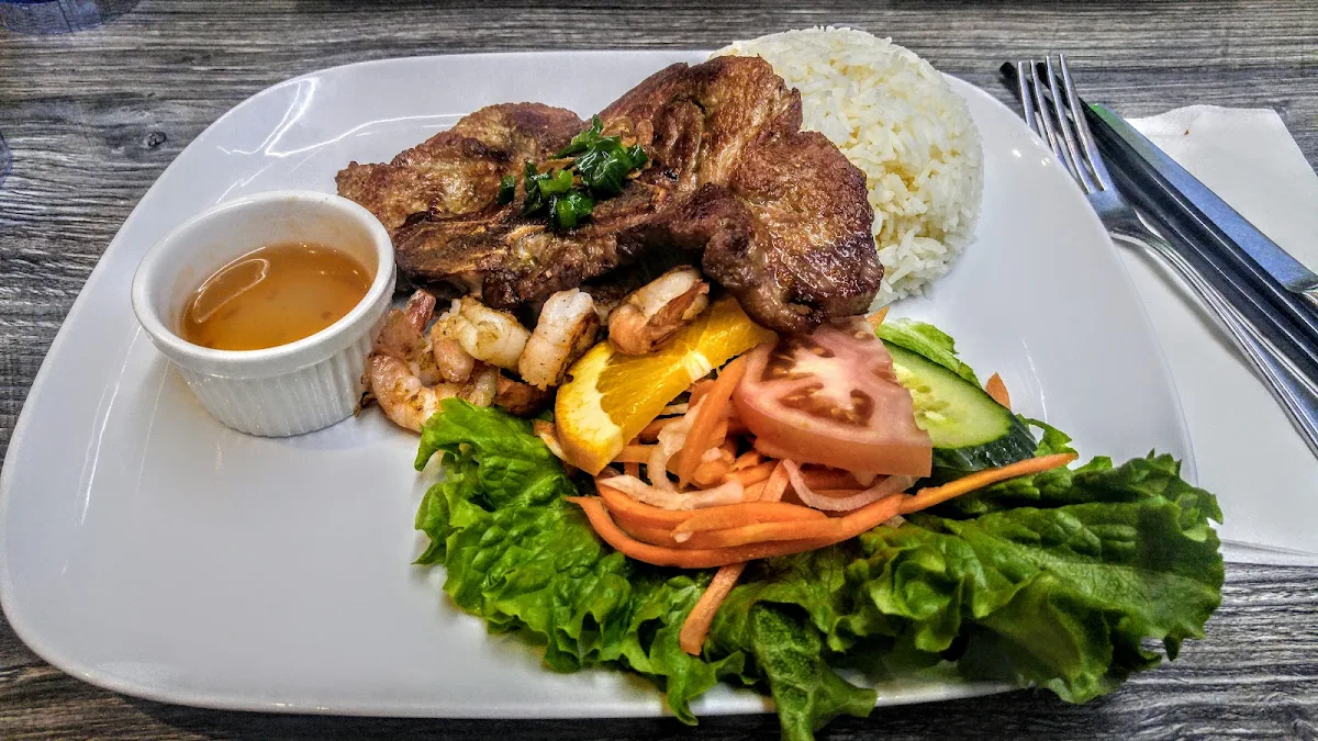Pork Chop and Grilled Shrimp over Rice