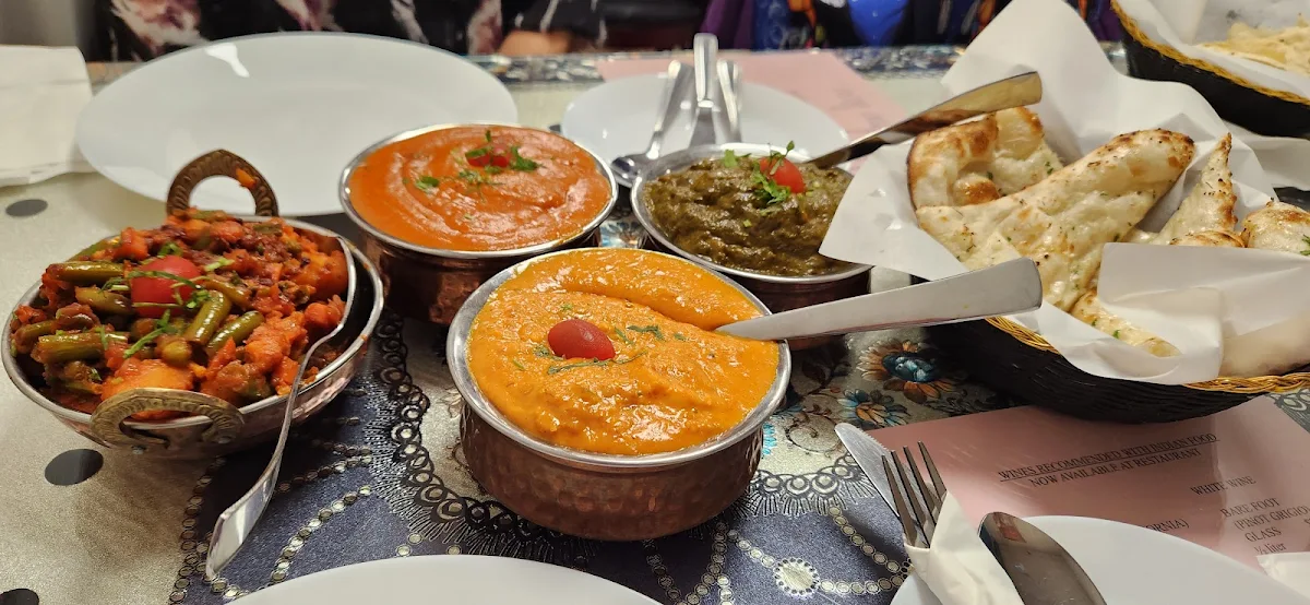 Butter Chicken Palak Paneer Shrimp Korma Mixed Veg Garlic Naan