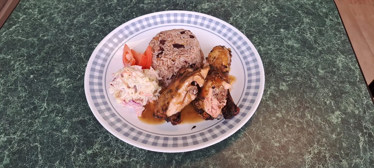 Jerk Chicken with Rice & Peas and Coleslaw Served with Jerk BBQ Sauce