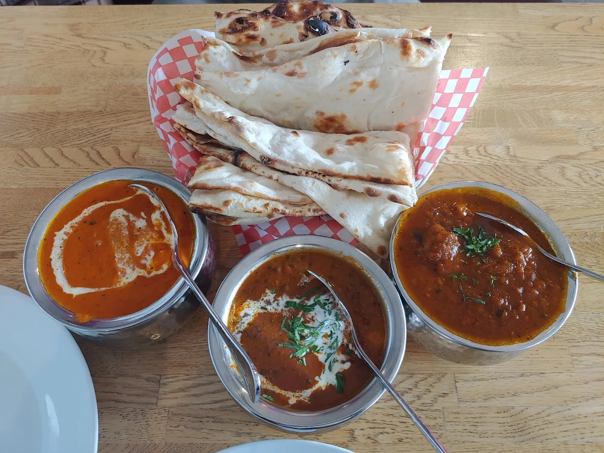 From Left Butter Chicken Middle Is Dhal Makani and Last One on the Right Is Goat Curry