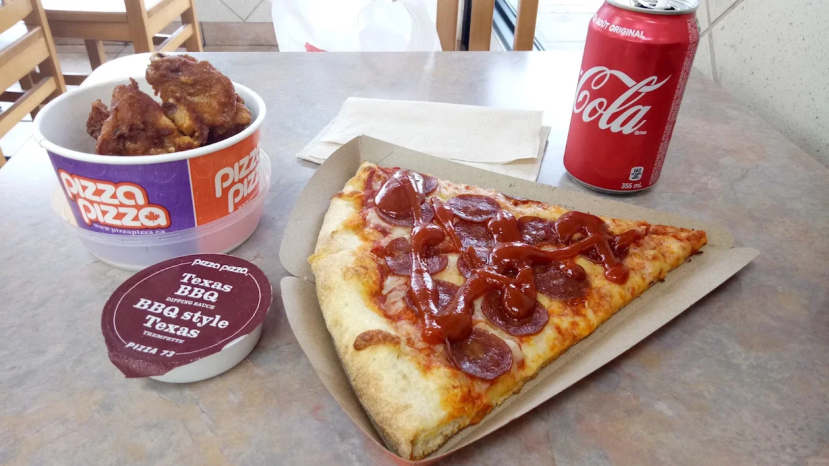 Pizza and Classic Chicken BBQ Sauce and Sweet Chili Thai Sauce Coca Cola