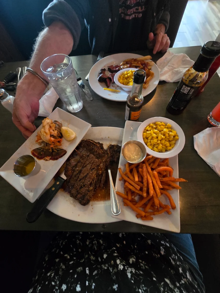 Porterhouse Steak with Sweet Potato Fries and Lobster Tail on the Side