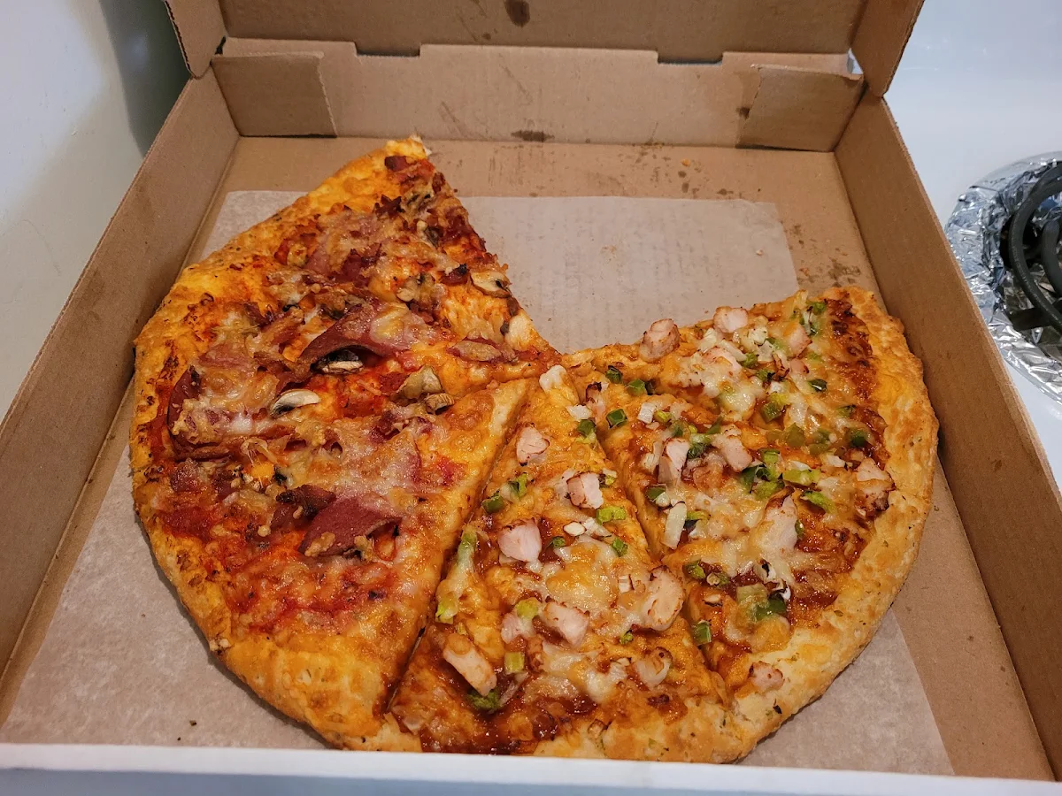 Half BBQ Chicken Pizza and Half Canadian Pizza