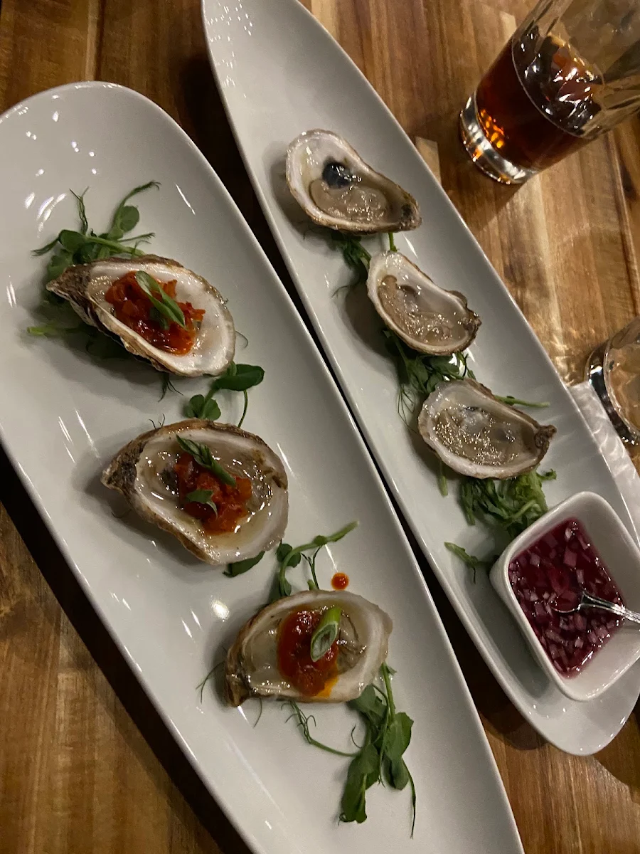 Daily Oyster Offering with Warm Gochujang Butter and Traditional Red Wine Mignonette