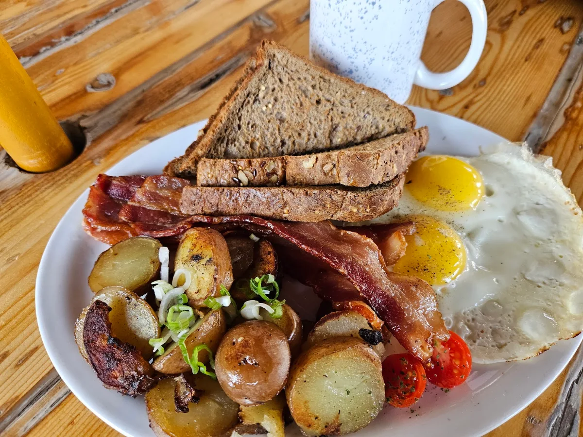 Route 97 Breakfast 2 Eggs Bacon Ham or Sausage Toast and Home-Made Hash