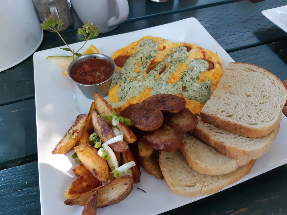 The Nacho Libre Chorizo Green Peppers Aged Cheddar Green Goddess Dressing and Fire Roasted Salsa