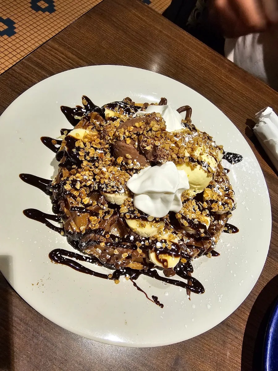 Freshly Made Waffles with Chocolate Ice Cream and Banana Toppings