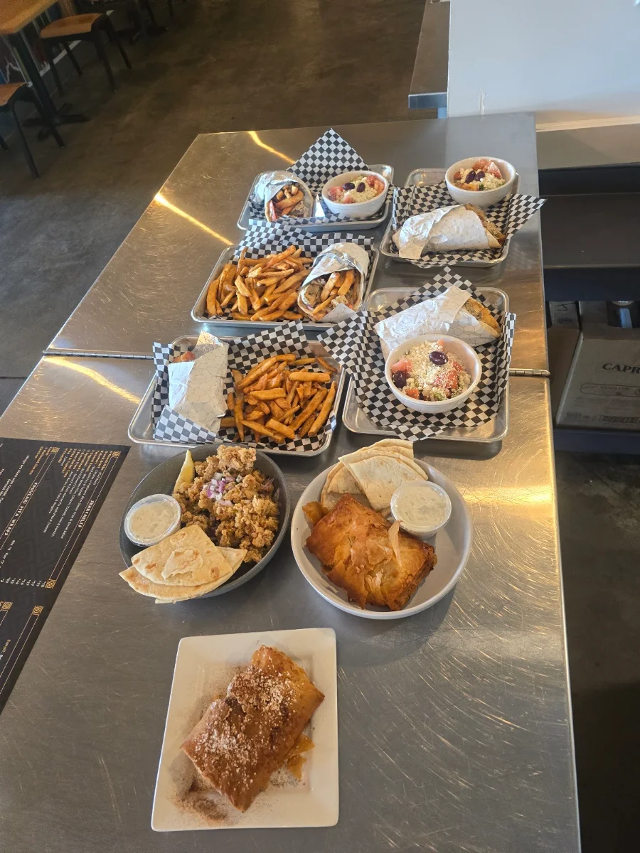 Souvlaki Wraps with Sides Appy Spanakopita Appy Kalamari and Bougatsa