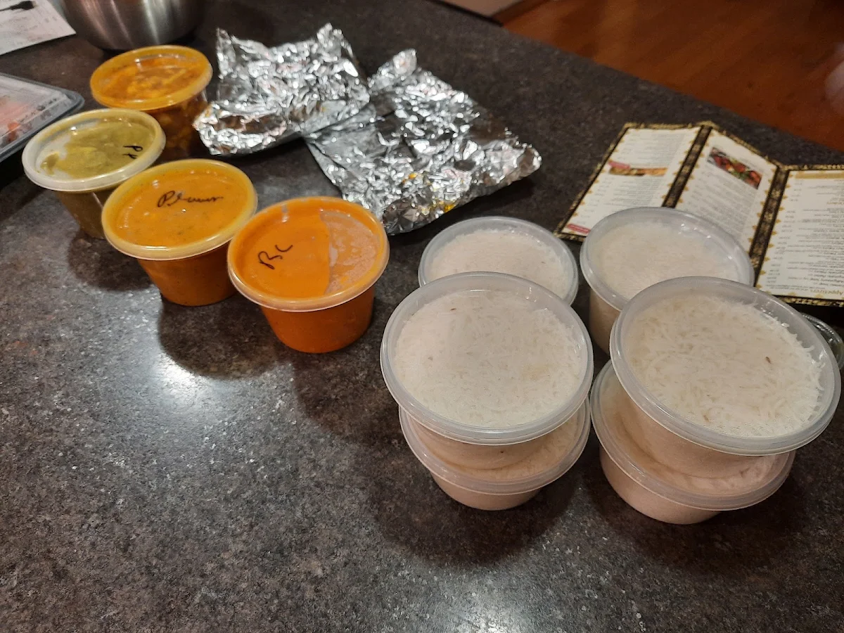 Naan Bread in Foil Aloo Gobi Palak Paneer Curry Prawns Butter Chicken and Basmati Rice