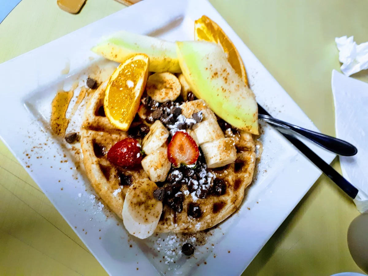 Waffles Drizzled in Chocolate with Bananas and Fresh Fruit