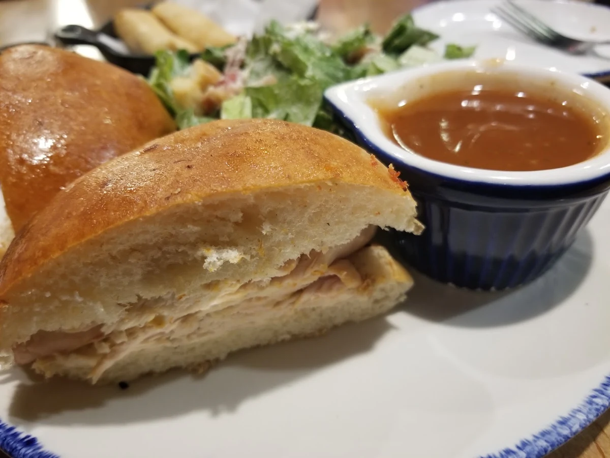 Rotisserie Chicken on a Bun with a Side Cesar Salad